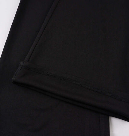 Close-up of the fabric texture of the Low-Waist Flared Leggings – Slim Fit in black.