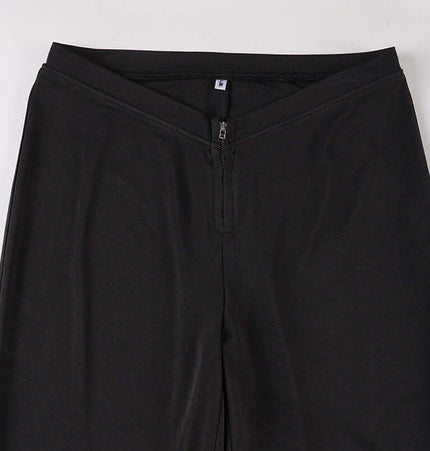 Low-Waist Flared Leggings – Slim Fit with V-shaped front and zipper detail.