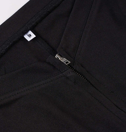 Close-up of the zipper detail on Grozavu Low-Waist Flared Leggings – Slim Fit, showcasing quality fabric and design.