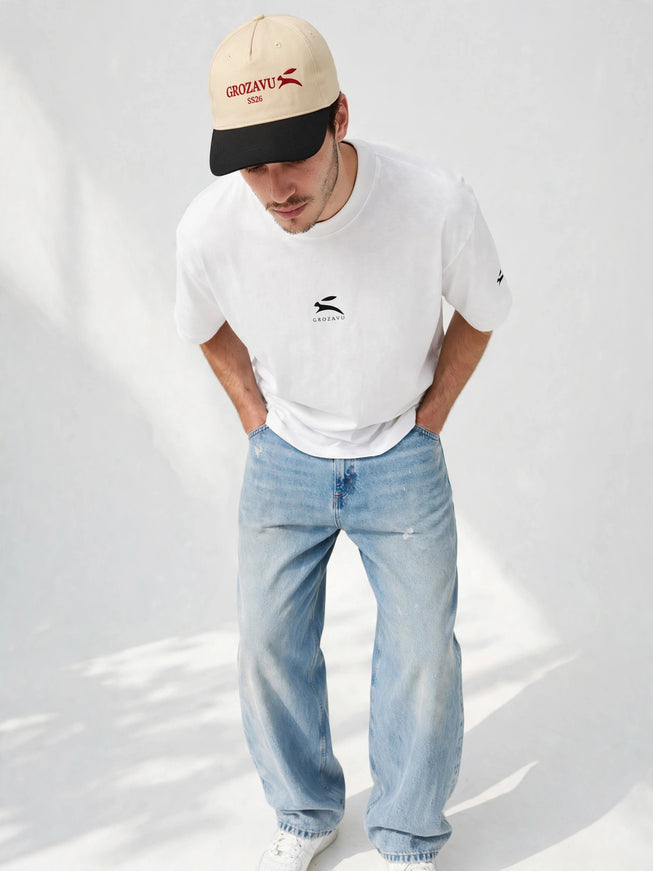 Low-angle portrait in the beige structured five-panel cap