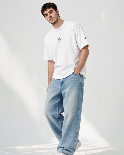 Low-angle shot of the white wide collar tee with dropped shoulders
