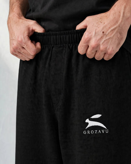 Macro of the 300 g/m² cotton stretch fabric on the wide-leg pants