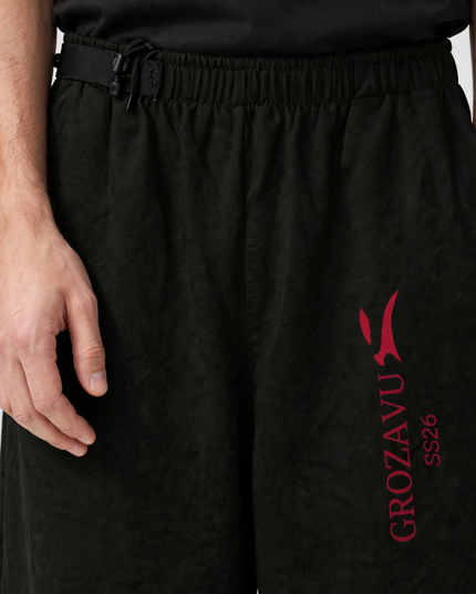 Adjustable waistband detail on the SS26 wide-leg pants