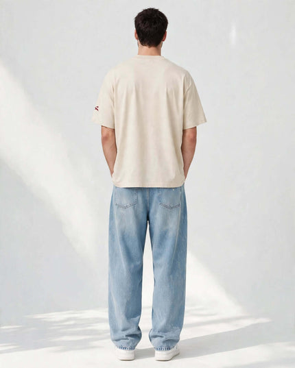 Back view of the beige oversized heavyweight tee in 237 g/m² cotton