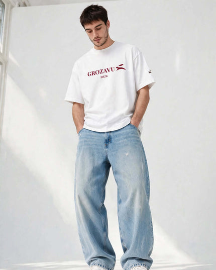 Low-angle shot of the white 237 g/m² oversized heavyweight tee