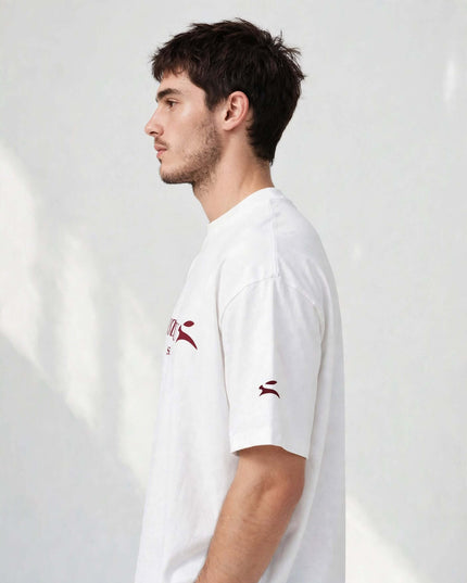 Side profile of the white heavyweight tee showing the oversized drop shoulder