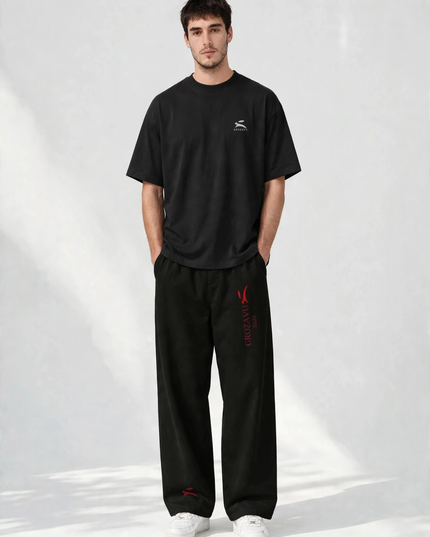 SS26 wide-leg pants with the deep red collection mark, studio front view