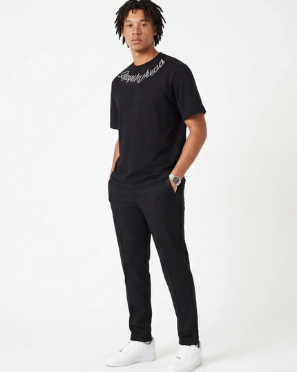 Lifestyle shot of the Maison Grozavu Sleek Carbon Tee in shirt — showing the relaxed fit.
