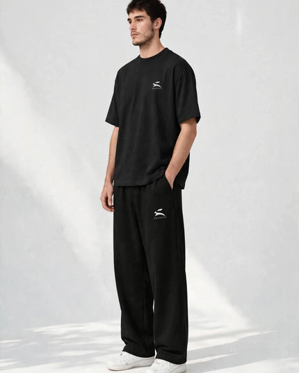 Three-quarter view of the men's black wide-leg cotton stretch pants