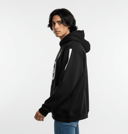 Oversized Hooded Sweatshirt – Loose Fit modeled by a young man in a black hoodie with a stylish design.