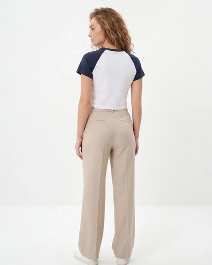 Rear view of the Maison Grozavu Seamless Ash Crop Top in top — showing the effortless drape.