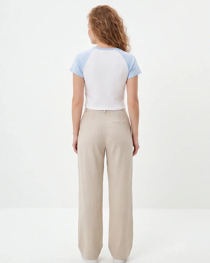 Rear view of the Maison Grozavu Seamless Ash Crop Top in top — showing the structural collar.