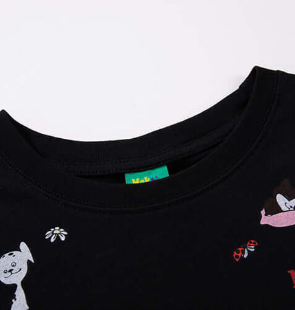 Close-up view of the MoKesch black t-shirt featuring playful cartoon animal graphics.