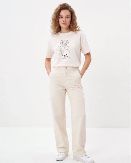 Bespoke Concrete Tee Vintage White — lifestyle detail of the Vintage White variant in motion showing relaxed sleeve drop