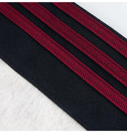 Close-up of National Trend Retro Stripe Loose Shirt featuring bold retro stripes in black and burgundy fabrics.