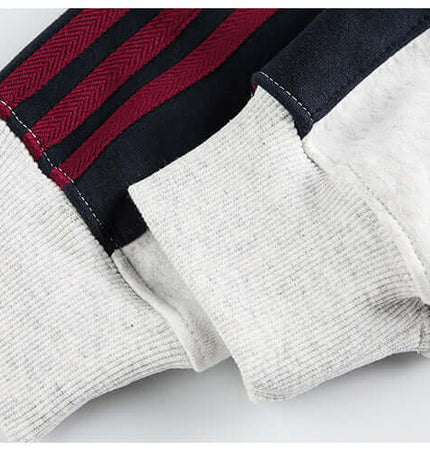 Detail of sleeves from the National Trend Retro Stripe Loose Shirt showcasing unique stripe design and fabric texture.