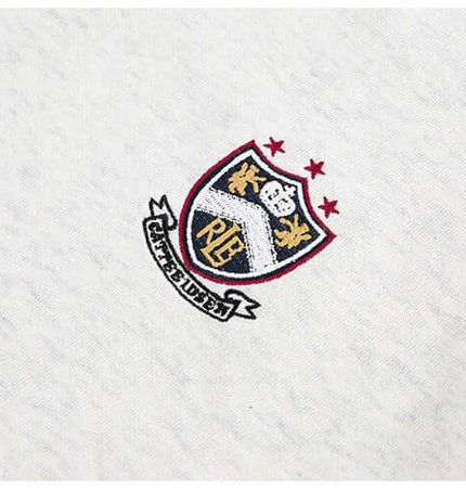 National Trend Retro Stripe Loose Shirt logo embroidered on fabric with shield design and stars.