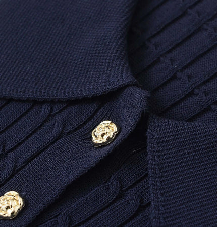 Close-up of the Grozavu Eight-Strand Braided Knit Top – Loose Fit showcasing navy color and textured knit design.