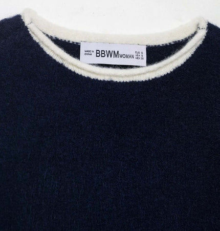 Color Block Patchwork Knit Sweater close-up showing round neckline and label detail