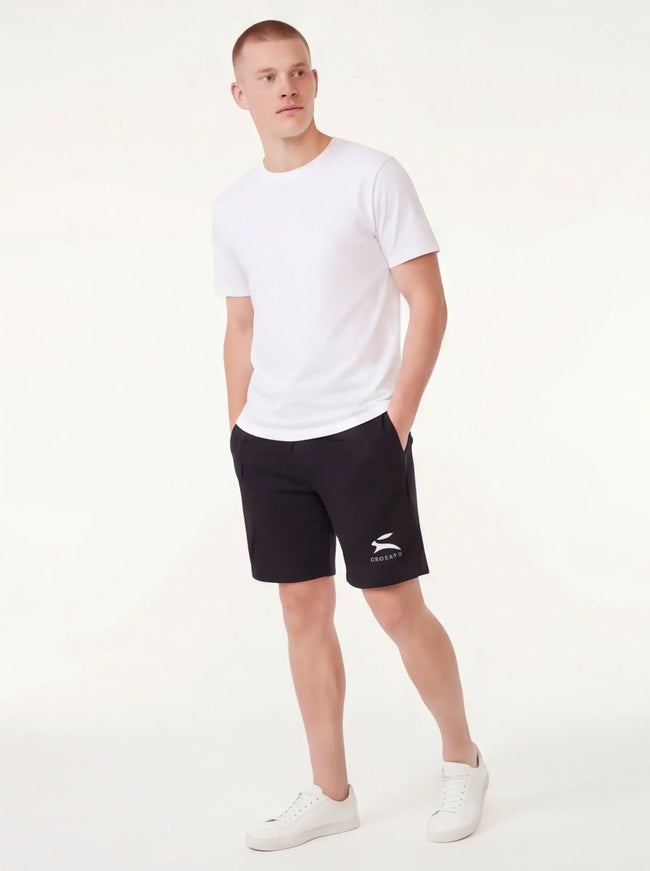 Model wearing fleece shorts by Grozavu