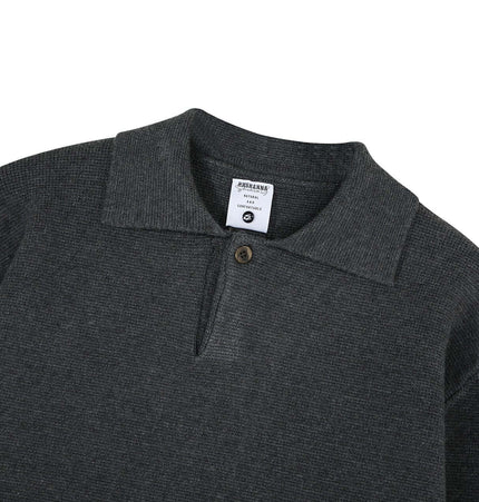 Notch Lapel Knit Sweater - Loose Fit in dark gray with a flip collar neckline and a button detail.
