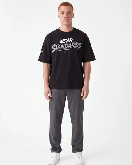 Flint Tee Weave lifestyle shot — natural drape of the 300 g/m² cotton-elastane fabric under directional light
