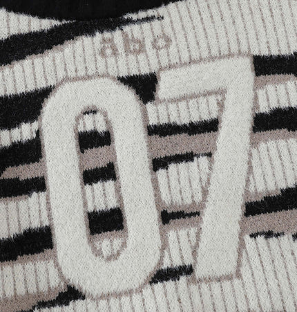 One-Shoulder Striped Knit Sweater – Slim Fit close-up showing striped pattern and number 07 detail.