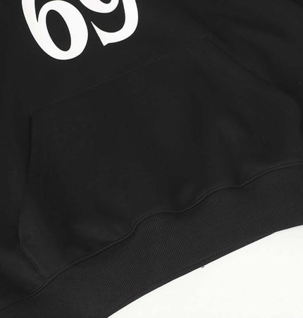 Oversized Hooded Sweatshirt – Loose Fit featuring a classic letter pattern on a black fabric.