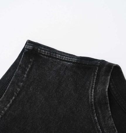 Close-up of the neckline and shoulder of an Oversized Printed Sleeveless Tank Top in black fabric.