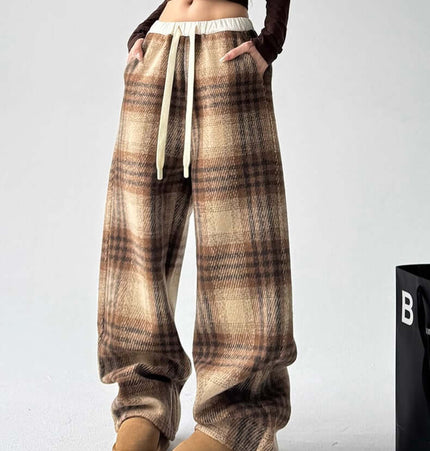 Plaid Flannel Fleece Lined Winter Pants with relaxed fit and fleece lining, styled with a brown long sleeve top.