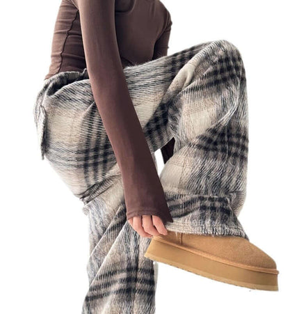 Plaid Flannel Fleece Lined Winter Pants worn by a model, showcasing the warm fleece lining and stylish plaid design.