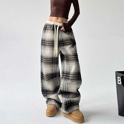 Plaid Flannel Fleece Lined Winter Pants showcased on a model, featuring a classic plaid pattern and relaxed fit.