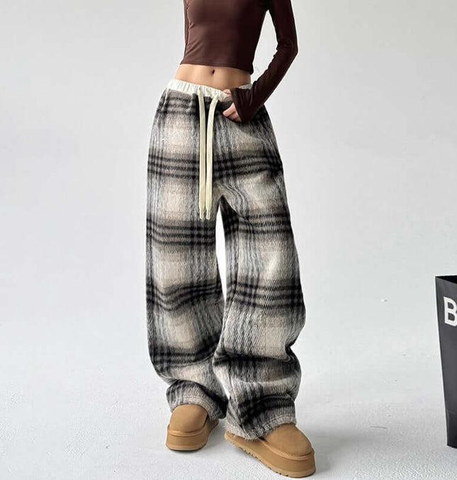 Plaid Flannel Fleece Lined Winter Pants showcased on a model, featuring a classic plaid pattern and relaxed fit.