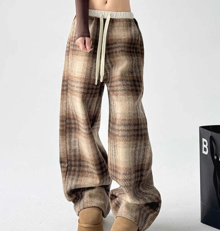 Plaid Flannel Fleece Lined Winter Pants featuring a checkered pattern and relaxed fit for warmth and style.