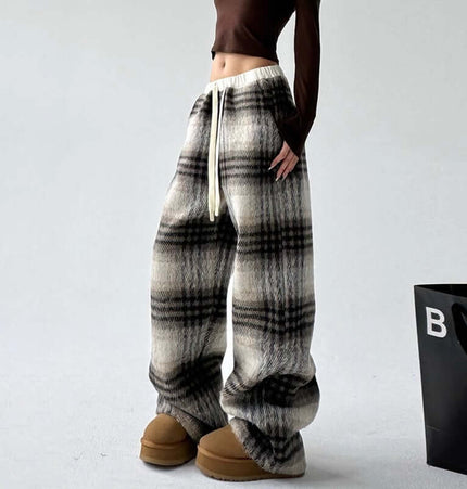 Plaid Flannel Fleece Lined Winter Pants model wearing stylish winter outfit with plaid pattern and fleece lining.