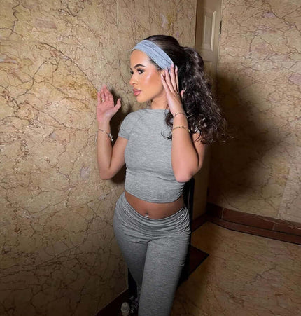 Pleated Short Sleeve Pants Set – Loose Fit worn by a model in a stylish setting, showcasing casual elegance and comfort.