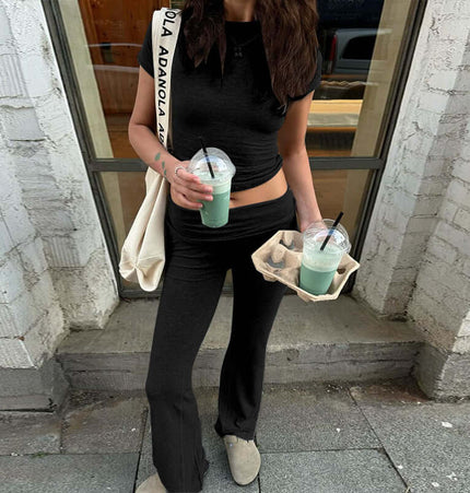 Grozavu Pleated Short Sleeve Pants Set – Loose Fit, featuring a solid color top and matching pants, ideal for casual outings.