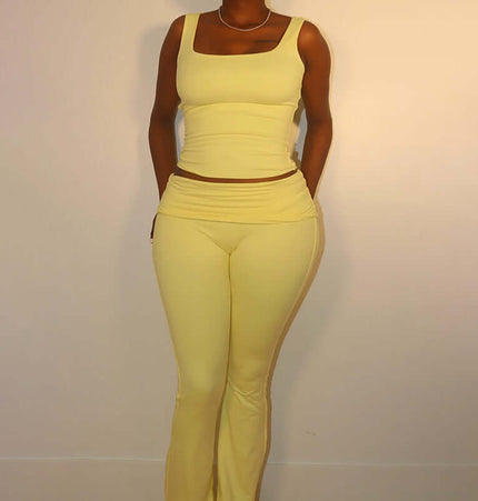 Woman wearing a Pleated Vest Two-Piece Set – Loose Fit in yellow, showcasing a modern casual style.