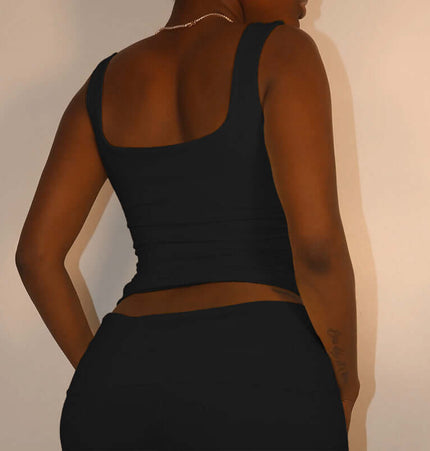 Pleated Vest Two-Piece Set – Loose Fit showcasing the back of a sleek black vest top.
