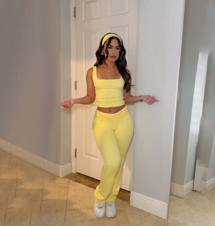 Pleated Vest Two-Piece Set – Loose Fit in vibrant yellow with a sleeveless top and matching long pants.