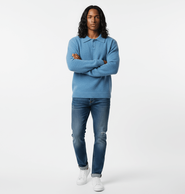 Polo Neck Knit Sweater - Loose Fit in blue worn by model, showcasing casual and comfortable style with jeans.