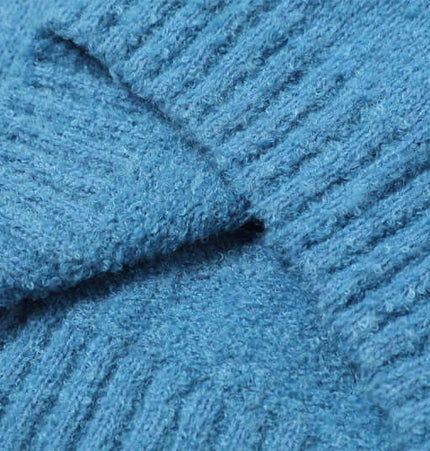 Polo Neck Knit Sweater - Loose Fit close-up of textured blue fabric showing soft knit and ribbed detail.