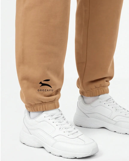 Detail shot of the Maison Grozavu Archival Umber Trousers in supreme — showing the sophisticated hardware.