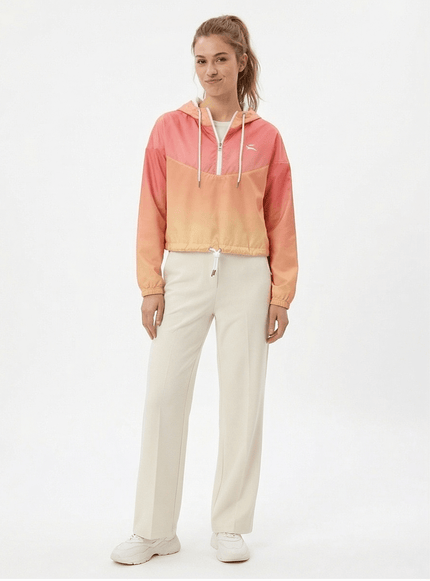 Model wearing cropped windbreaker by Grozavu