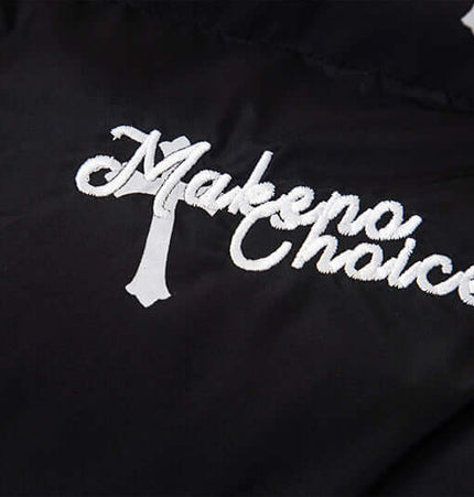 Close-up of embroidered logo on the Print Stand Collar Cotton Puffer Jacket for Women, showcasing modern street style.