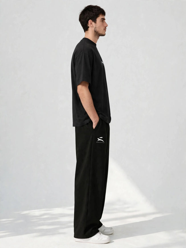 Side profile of the black 300 g/m² cotton stretch wide-leg pants