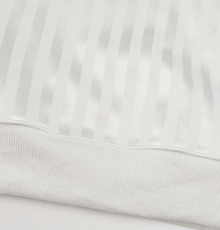 Retro Dark Stripe Patchwork Hoodie close-up of the striped fabric texture and ribbed hem.