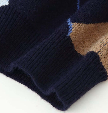 Close-up of fabric detailing on the Retro Diamond Grid Round Neck Sweater showcasing its vintage plaid pattern.