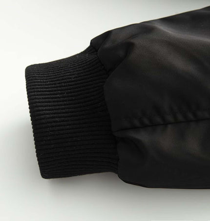 Close-up detail of the sleeve cuff of the Retro Flight Jacket – Oversized showcasing its durable fabric and design.