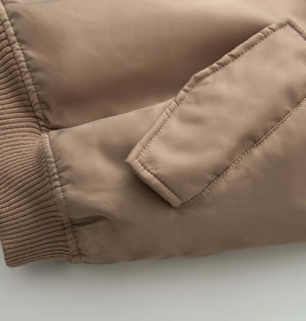 Close-up of sleeve detail on the Retro Flight Jacket – Oversized in beige, showcasing fabric and pocket design.